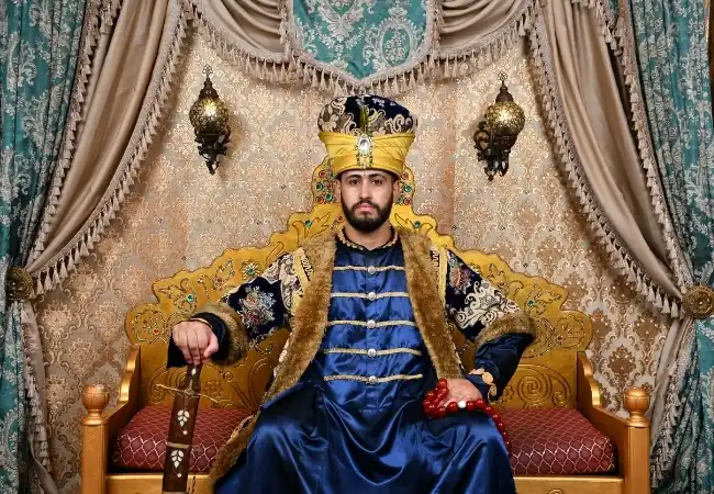 Ottoman Sultan costume photo experience with traditional royal clothing and throne setting