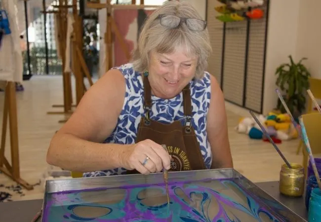 Woman creating a traditional Turkish ebru marbling design