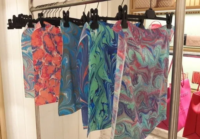 Colorful Turkish marbling pattern scarves displayed indoors