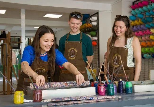 Participants creating traditional Turkish ebru marbling art in a workshop